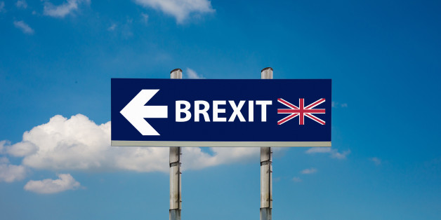 a road signs EU and BREXIT and a blue sky